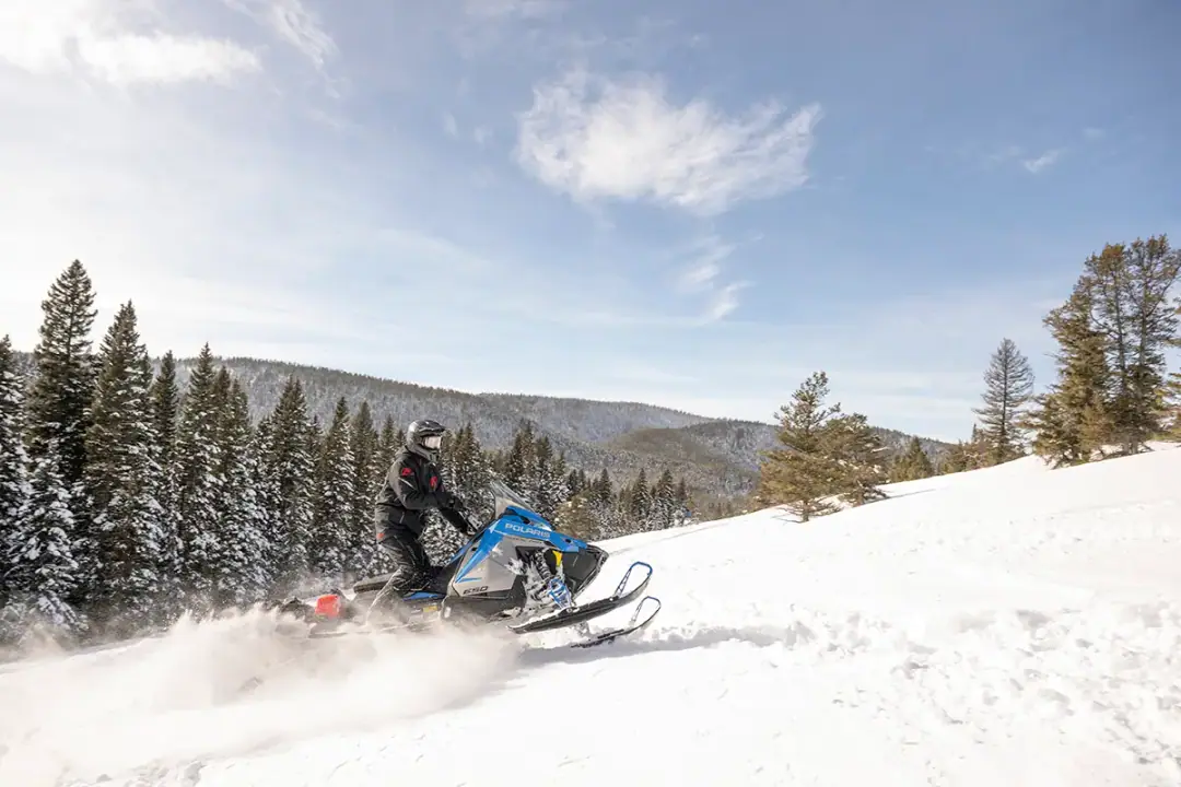 Polaris snowmobile on a Colorado backcountry trail